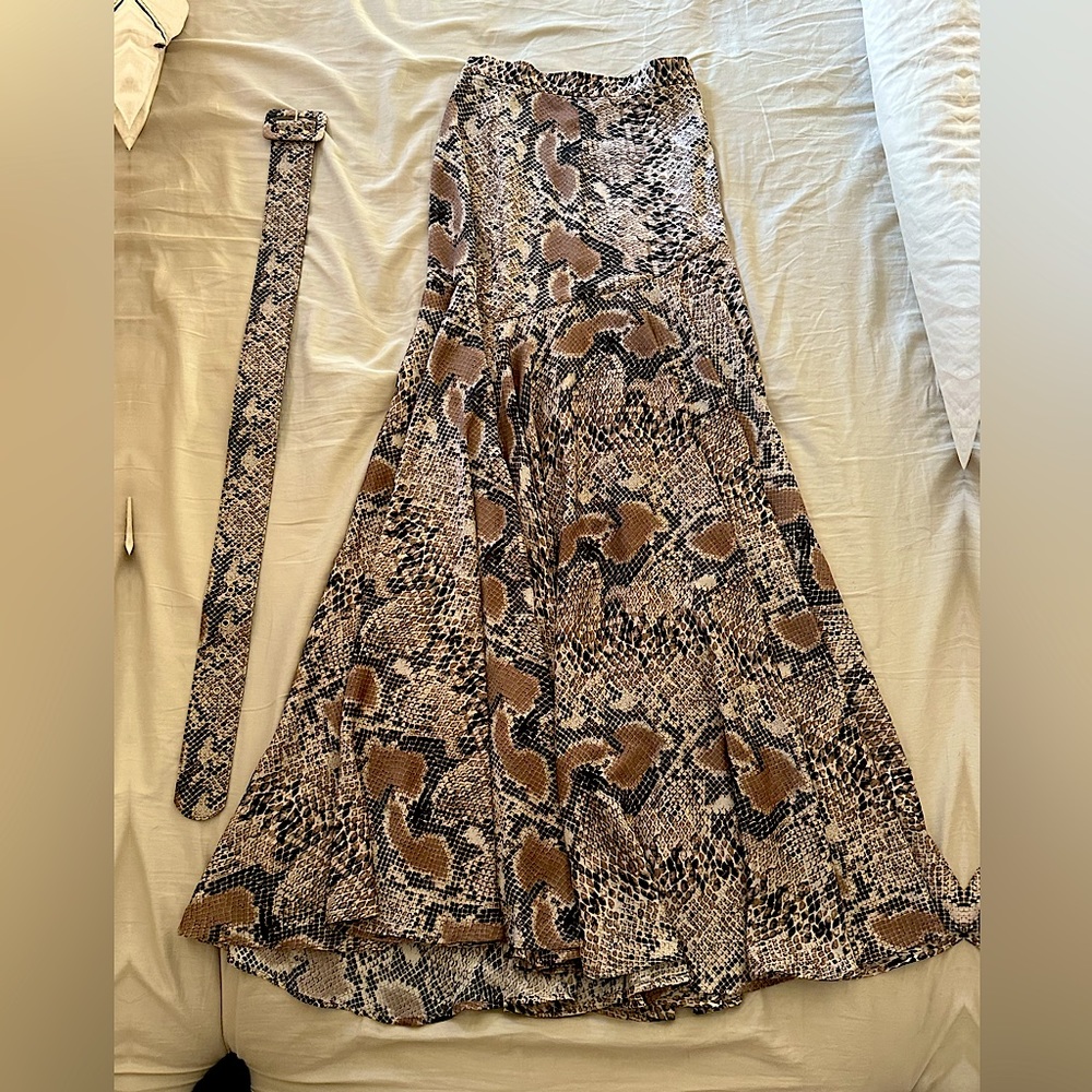 Never worn snake skin print long skirt.